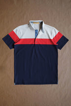 The Dunne Performance Polo - Fawn / Navy Heritage Colorblock